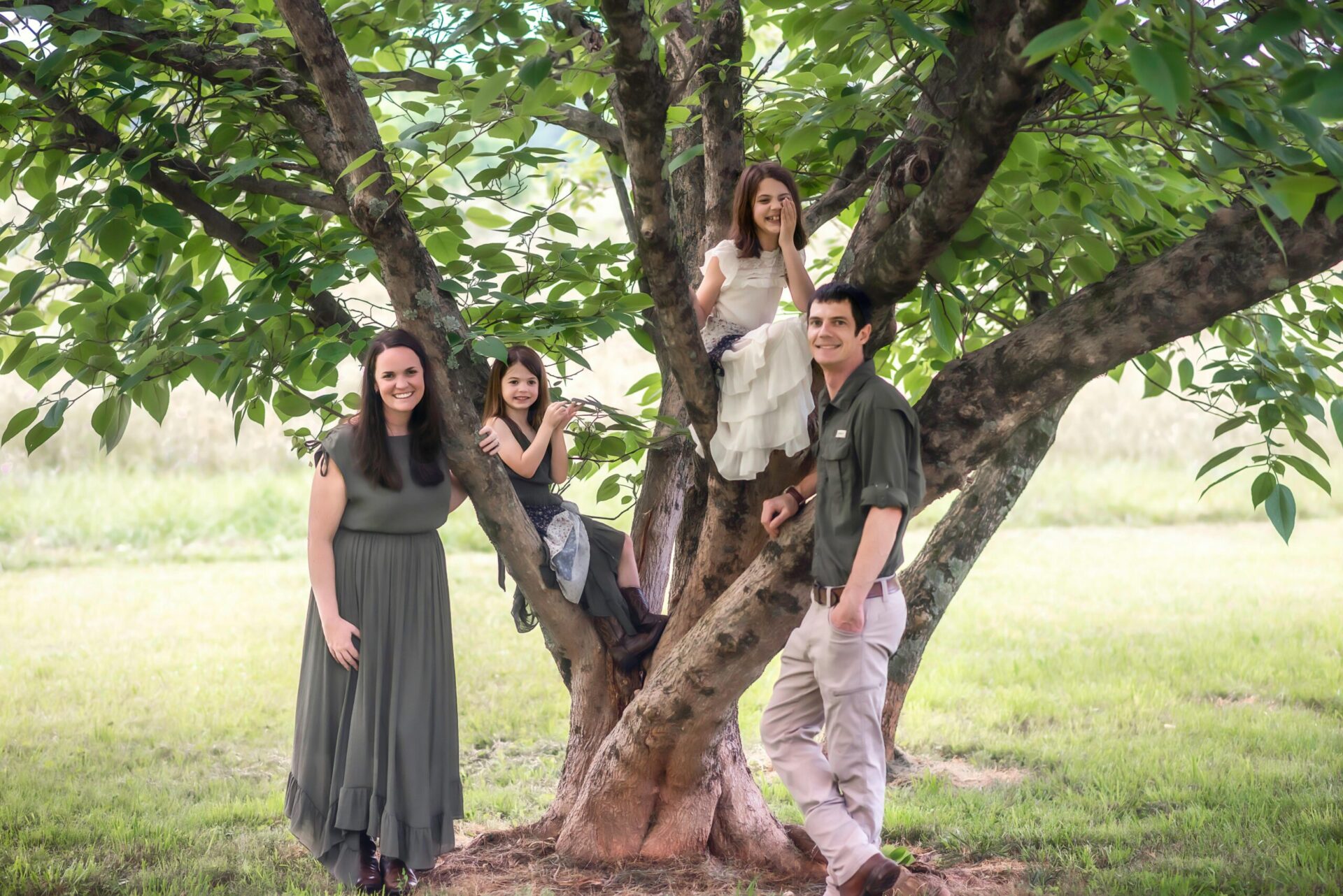 Family portrait of a joyful family spending quality time outdoors, enjoying nature.